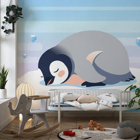 Antarctic penguin wallpaper in cozy children's bedroom with natural wood furniture