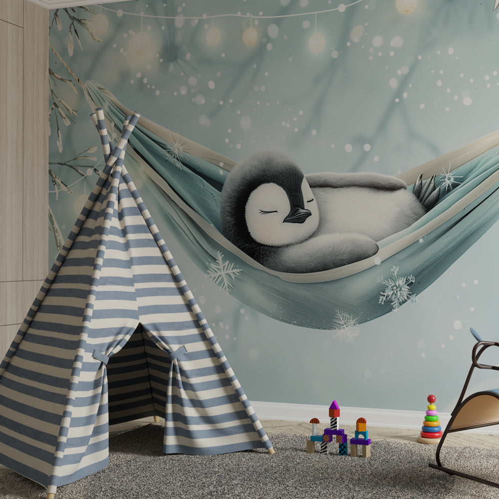 Winter penguin mural wallpaper transforming baby room with gentle snowflakes and blue tones