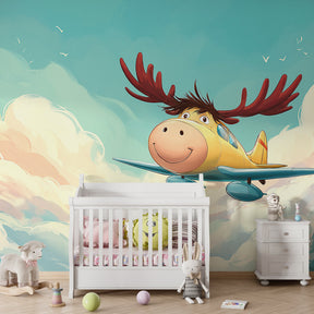 Children's bedroom featuring pilot moose aviation mural wallpaper with mountain landscape background