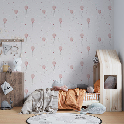 Kids-Mundo pink balloon wall mural adding a playful backdrop to a children's playroom