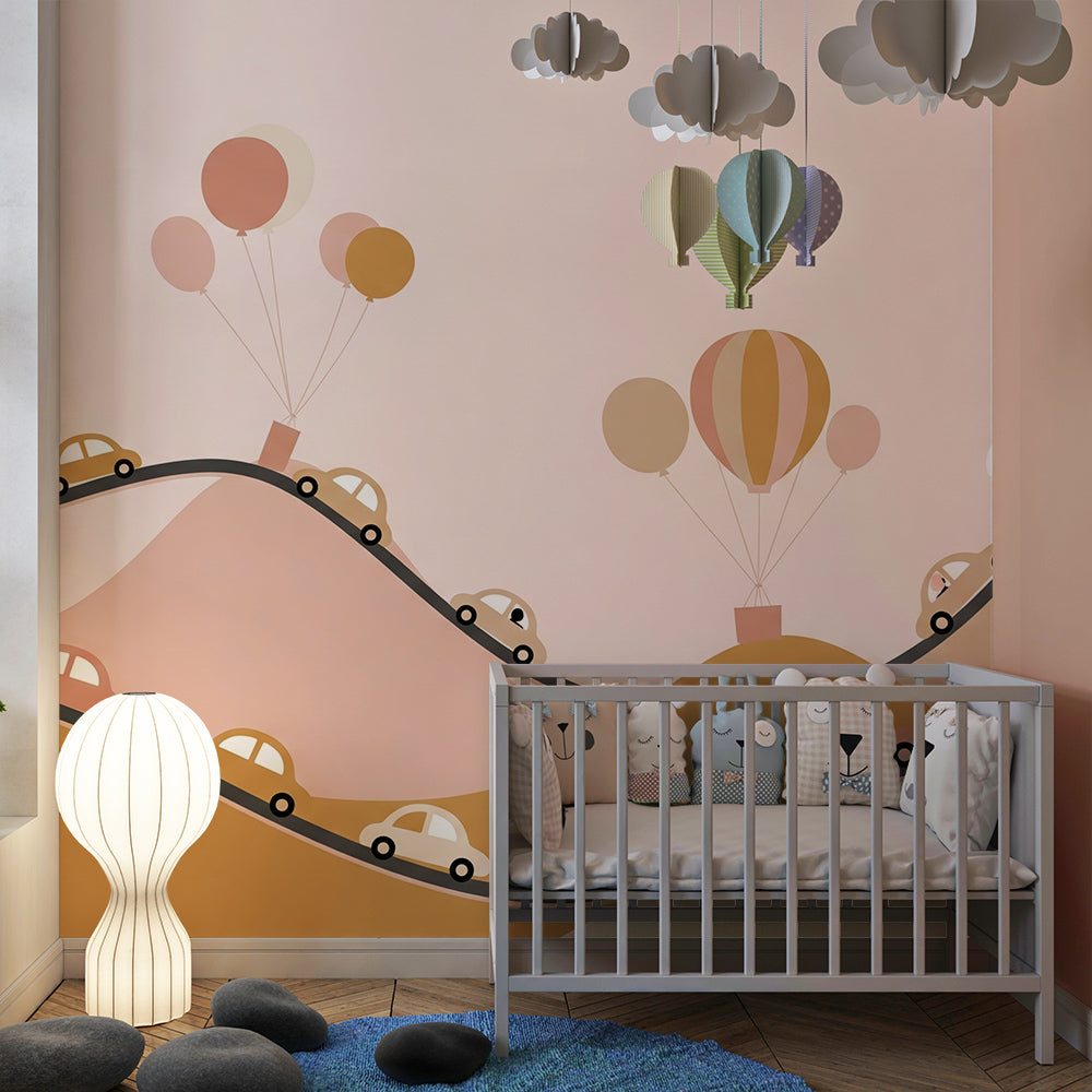 Kids-Mundo pink road trip wall mural brightening a playroom with cars and floating balloons