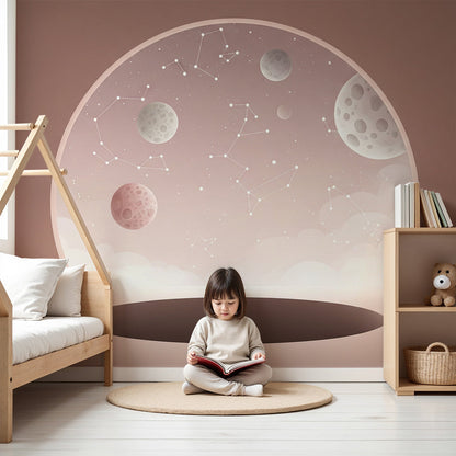 Kids-Mundo blush pink space wall mural with moons and stars styled in a soft pastel nursery