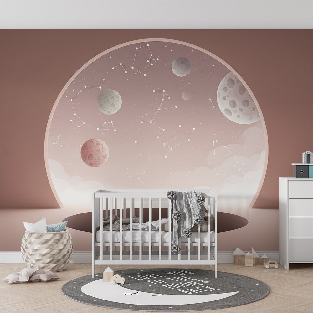 Kids-Mundo pink galaxy wall mural with moons and constellations decorating a bright playroom wall