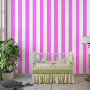 Bold pink striped wallpaper transforming children's playroom with vibrant vertical design