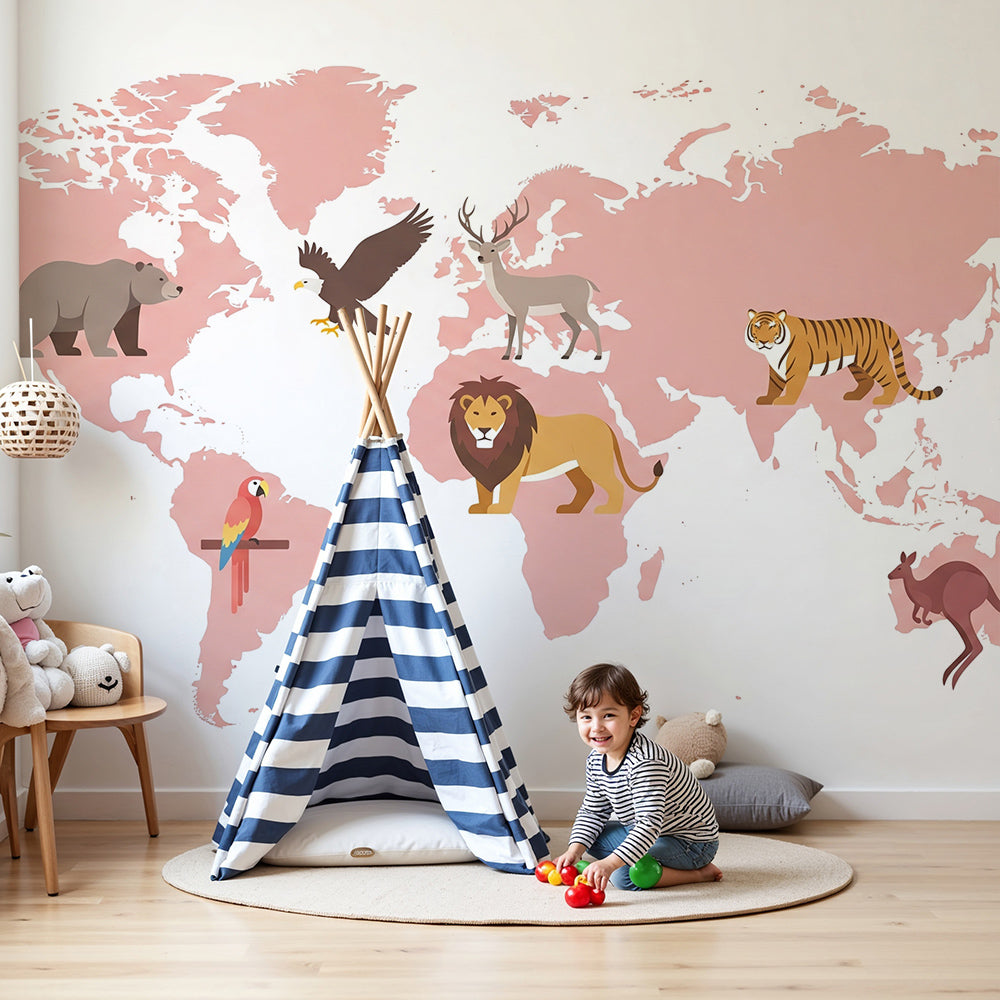 Kids-Mundo blush-pink world map wall mural with animal illustrations behind a cot in a nursery