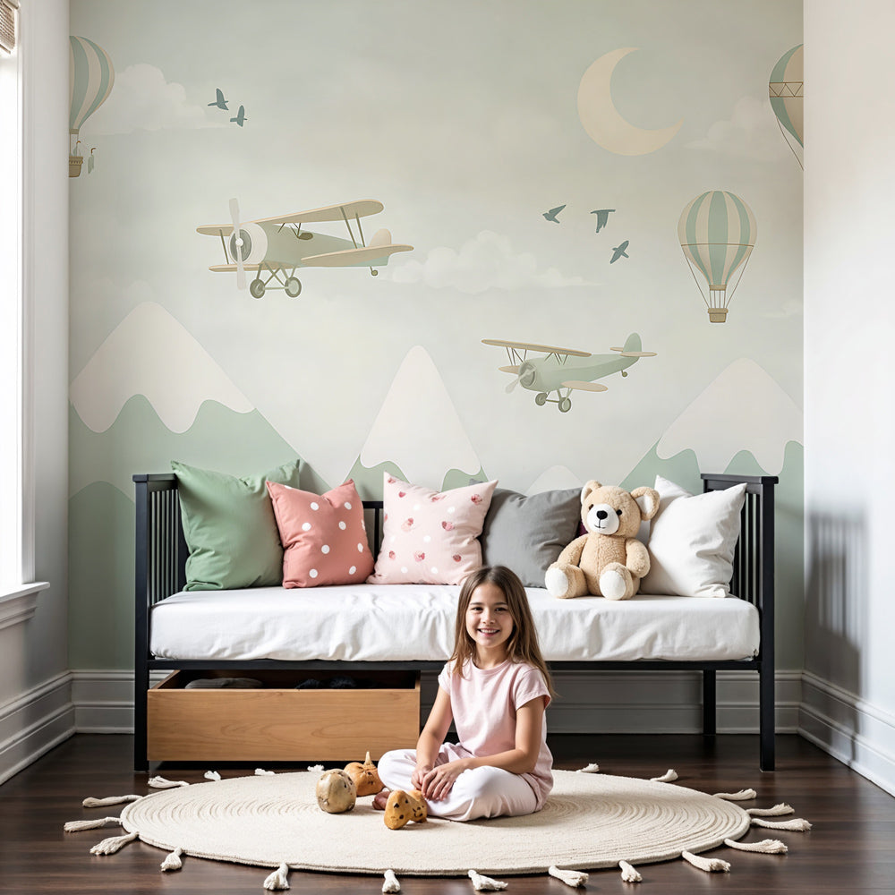 Kids-Mundo hot air balloon and biplane wall mural styled in a soft sage-green nursery