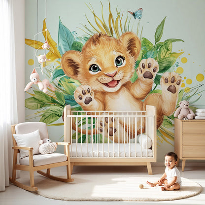 Kids-Mundo lion cub wall mural styled in a bright mint-green nursery with jungle leaf accents.
