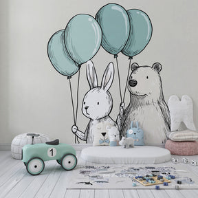 Animal balloon wallpaper creating whimsical atmosphere in cozy baby room decor