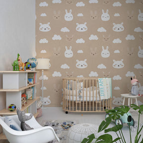 Soft beige rabbit wallpaper creating peaceful kids bedroom atmosphere with bunny cloud motifs
