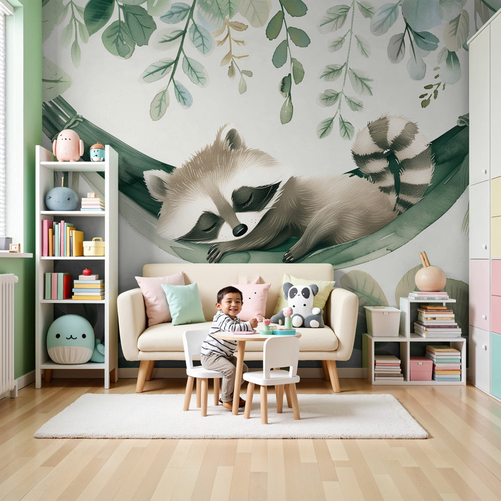 Kids-Mundo sleeping raccoon wall mural styled as a feature wall in a leafy green nursery