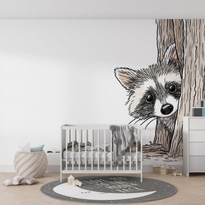 Woodland raccoon wallpaper creating magical forest atmosphere in kids playroom