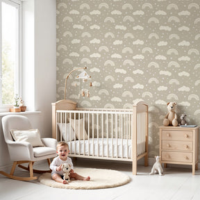 Rainbow clouds mural wallpaper in bright kids nursery with wooden crib by Kids-Mundo