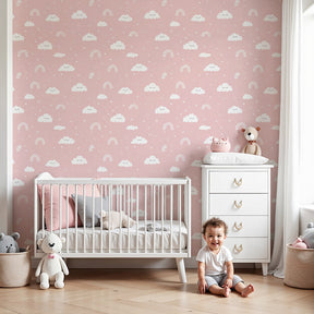 Rainbow clouds mural wallpaper creating dreamy pink nursery atmosphere by Kids-Mundo