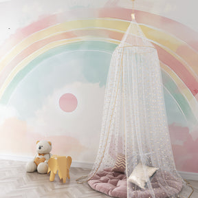 Soft pastel rainbow mural wallpaper with sun creating dreamy kids room environment by Kids-Mundo