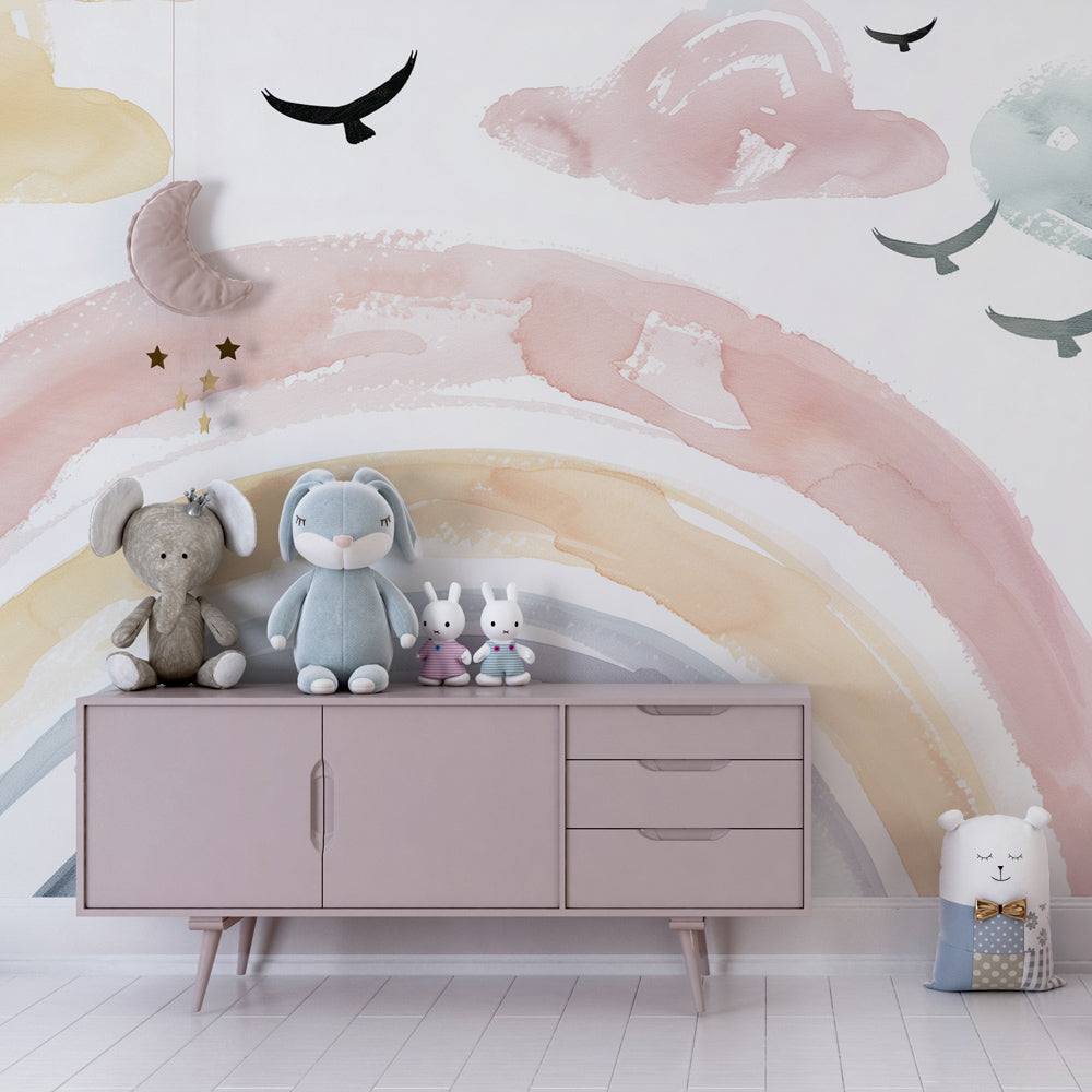 Soft rainbow cloud wallpaper creating calm atmosphere in toddler bedroom with natural lighting