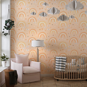 Soft orange and beige rainbow mural wallpaper transforming kids playroom into dreamy space