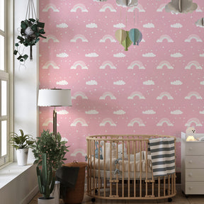Soft pink rainbow wallpaper transforming kids bedroom into dreamy sanctuary by Kids-Mundo