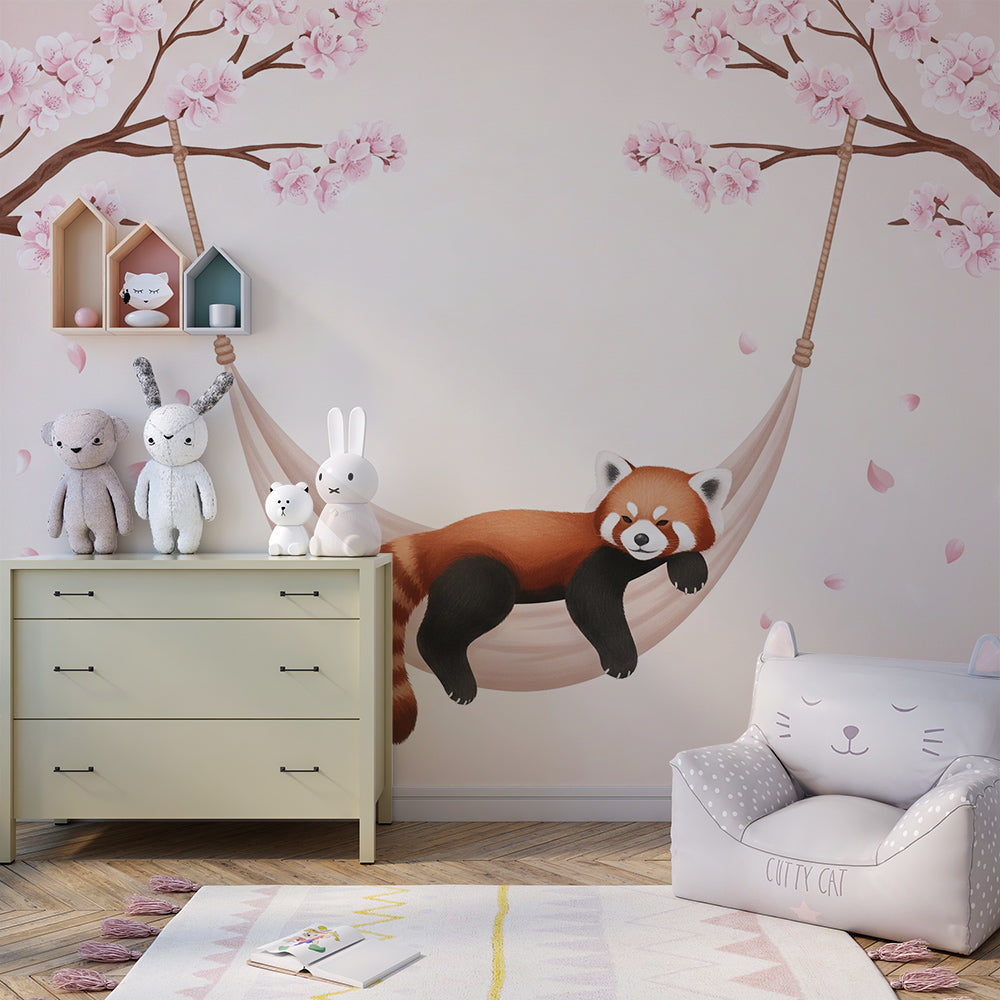 Kids-Mundo sleepy red panda cherry blossom wall mural covering a wall in a bright children's playroom