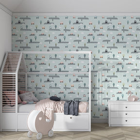 Children's bedroom featuring road theme wallpaper with winding paths and cute cars