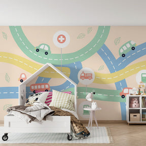 Automotive themed mural wallpaper creating fun playroom atmosphere with toy cars