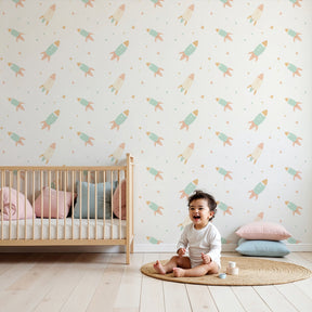 Pastel rocket mural wallpaper creating dreamy space themed nursery by Kids-Mundo