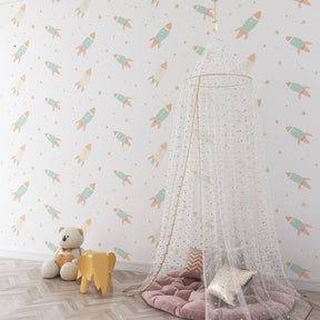 Gentle pastel space mural wallpaper for toddler room with wooden furniture by Kids-Mundo
