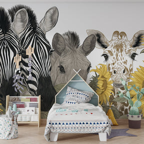 Zebra and giraffe mural wallpaper creating adventure atmosphere in kids playroom