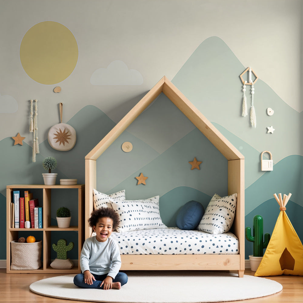 Kids-Mundo sage green mountain wall mural in a calm nursery with a cot and soft neutral decor