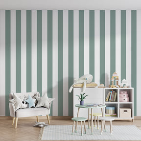 Children's bedroom featuring sage green vertical stripe wallpaper with light wood furniture