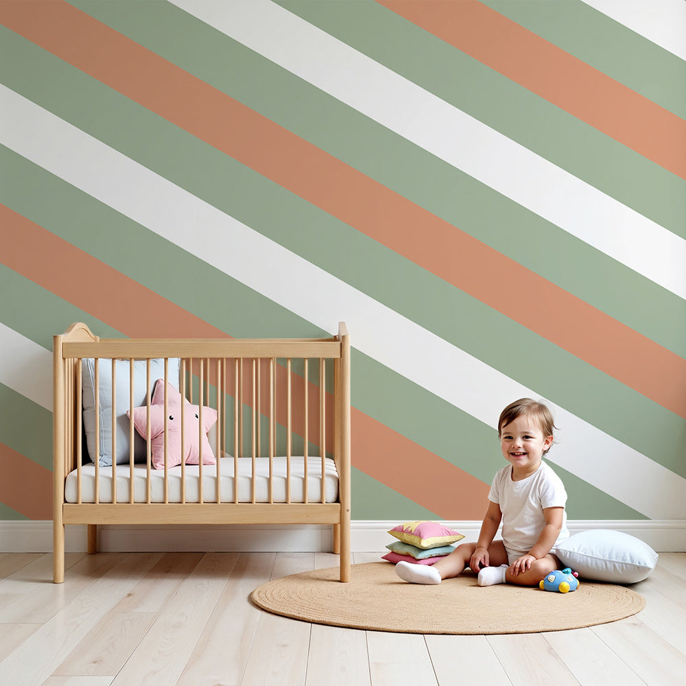 Kids-Mundo sage green and terracotta stripe wall mural styled behind a cot in a natural nursery