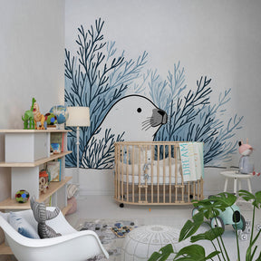 Ocean-themed children's bedroom with sea otter and seaweed mural wallpaper