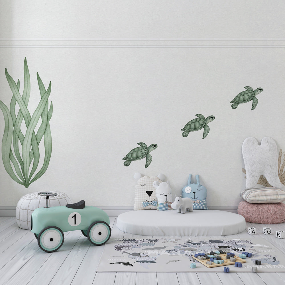 Ocean themed nursery featuring sea turtle wallpaper with aquatic plants and soft colors