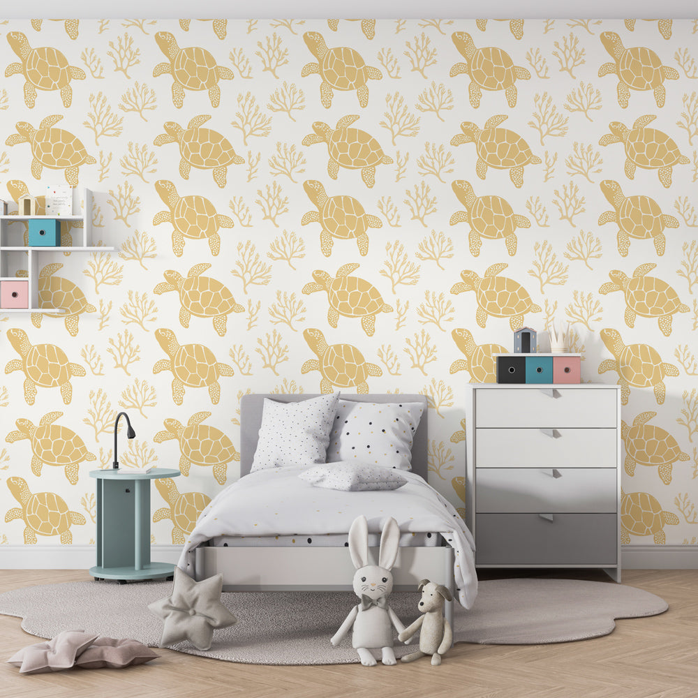 Ocean-themed children's bedroom featuring sea turtle wallpaper with golden accents and coral patterns