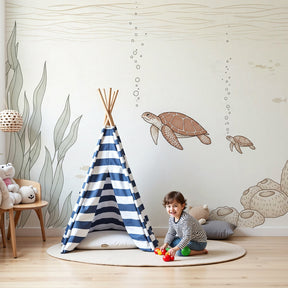 Sea turtle mural wallpaper in peaceful baby nursery with natural wood furniture by Kids-Mundo