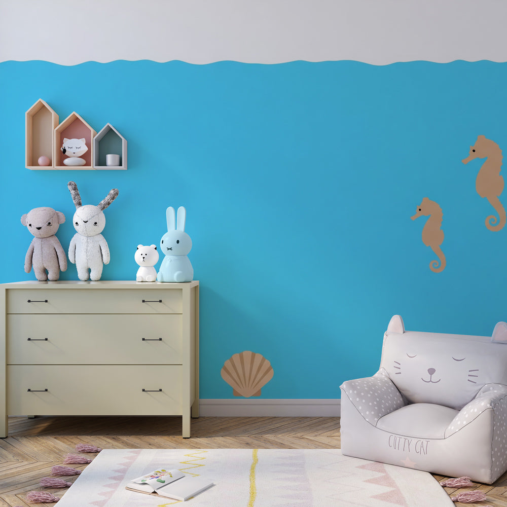 Blue seahorse wallpaper transforming baby bedroom into calming marine sanctuary