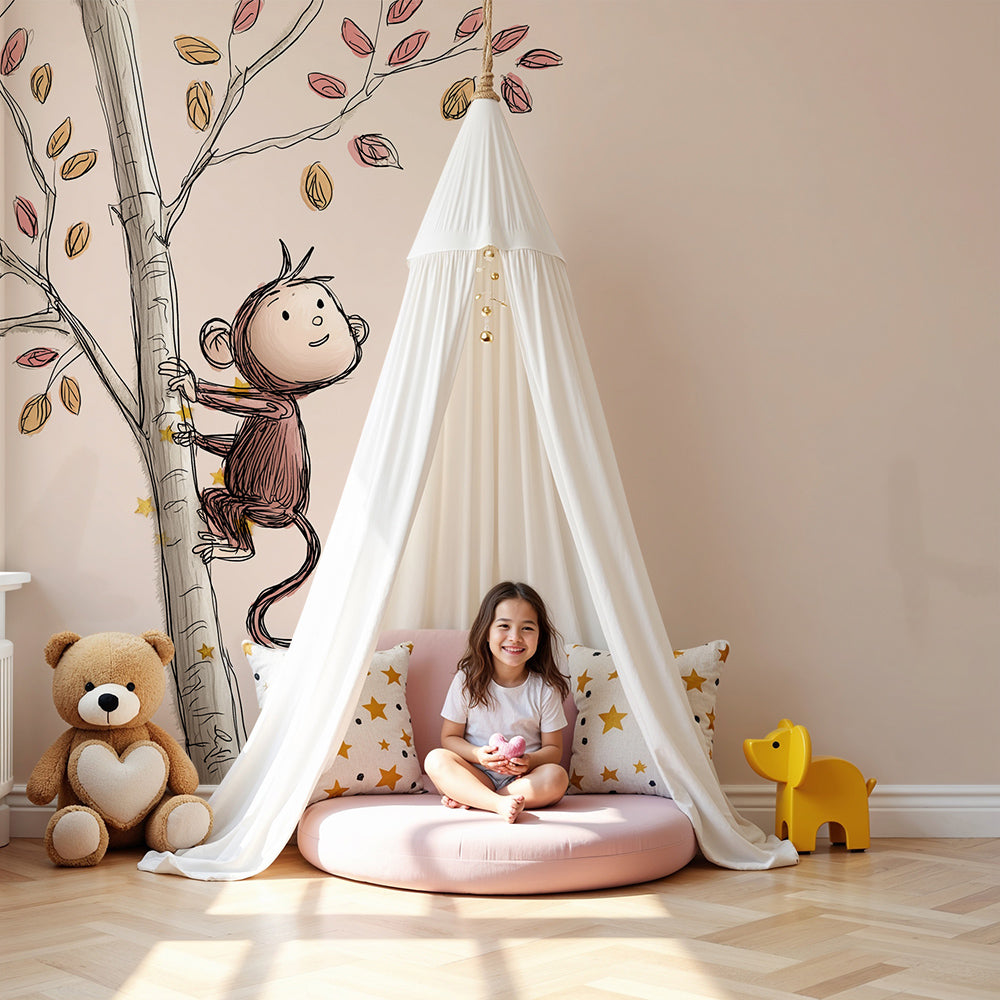 Kids-Mundo sketchy monkey autumn tree wall mural styled in a soft neutral nursery with cot and rug.