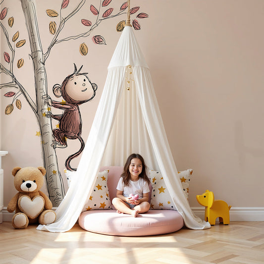 Kids-Mundo sketchy monkey autumn tree wall mural styled in a soft neutral nursery with cot and rug.