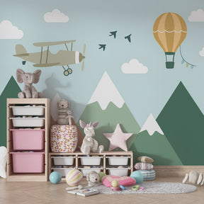 Aviation themed mural wallpaper creating dreamy children's bedroom atmosphere with mountain scenery