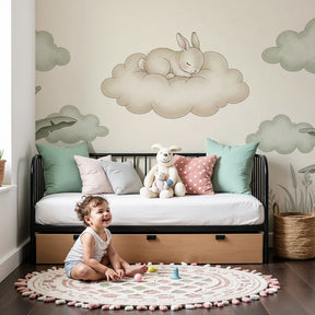 Sleeping bunny on cloud mural wallpaper in peaceful cream nursery with wooden crib by Kids-Mundo