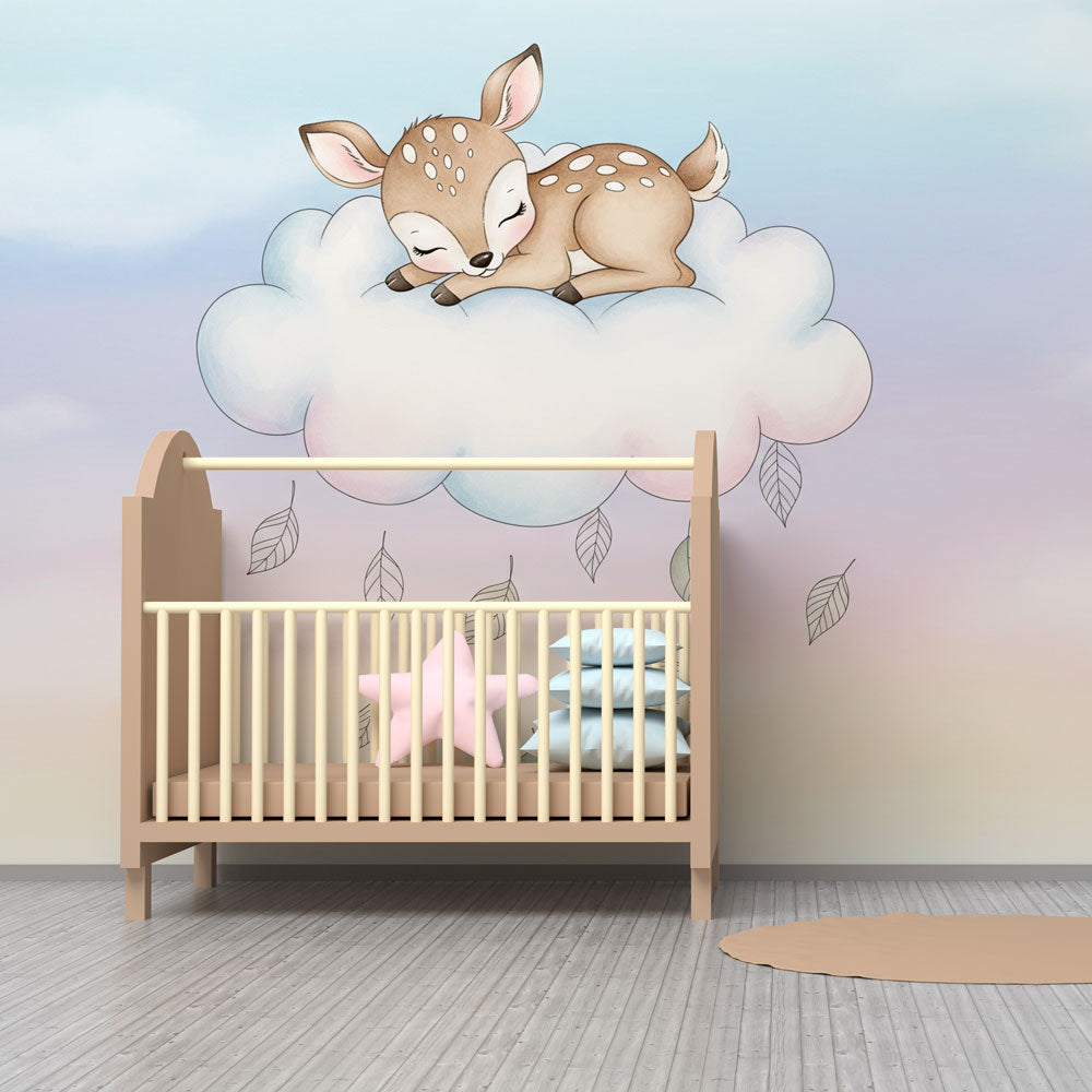 Baby room mural wallpaper featuring sleeping fawn on cloud with soft pink and blue tones