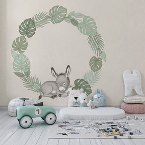 Peaceful baby room with sleeping donkey mural wallpaper in soft green and beige tropical theme