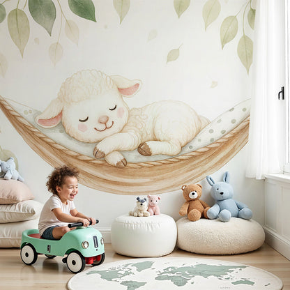 Kids-Mundo sleeping lamb wall mural in a warm, cosy baby nursery with hanging leaves