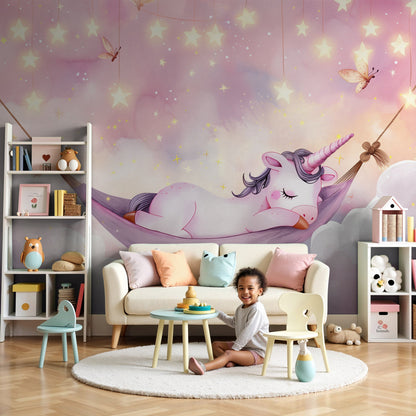 Kids-Mundo sleeping unicorn wall mural styled in a dreamy pastel pink nursery.