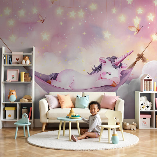 Kids-Mundo sleeping unicorn wall mural styled in a dreamy pastel pink nursery.