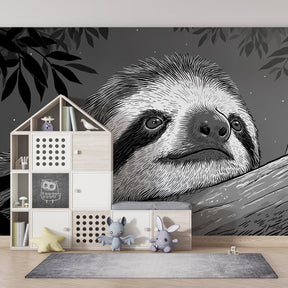 Monochrome sloth jungle wallpaper in children's bedroom with natural wood furniture