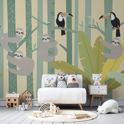 Kids-Mundo sloths and toucans jungle wall mural brightening a playroom with cushions and toys.