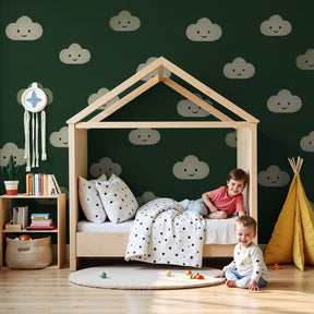 Smiling clouds mural wallpaper creating peaceful green nursery decor by Kids-Mundo