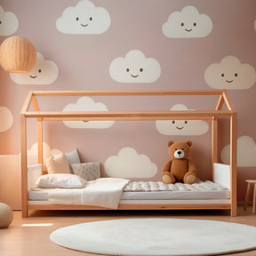 Whimsical pink clouds mural wallpaper bringing joy to children's playroom decor