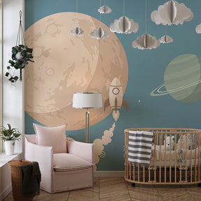 Rocket and planets mural wallpaper creating magical kids bedroom decor with soft blue tones