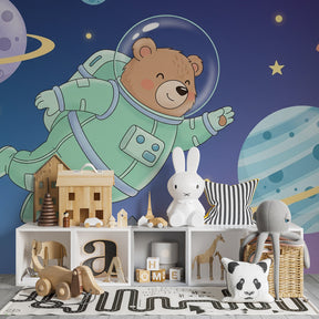 Space adventure mural wallpaper with teddy bear astronaut for children's playroom by Kids-Mundo